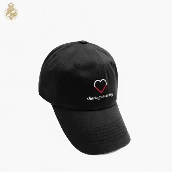Black cap with a heart and text design on a white background