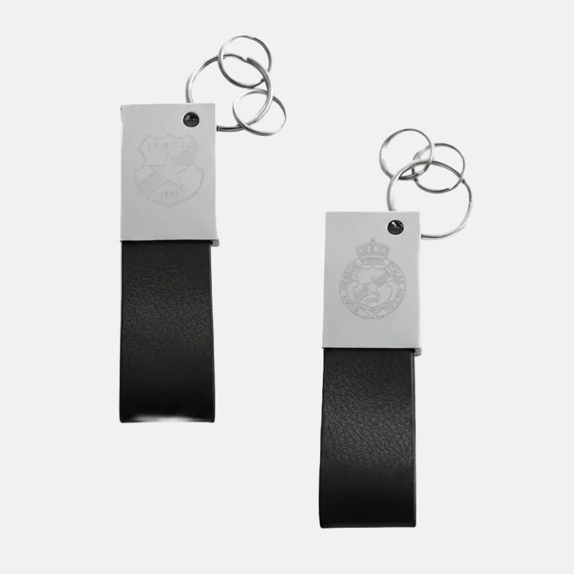Two black leather keychains with metal tags on a white background